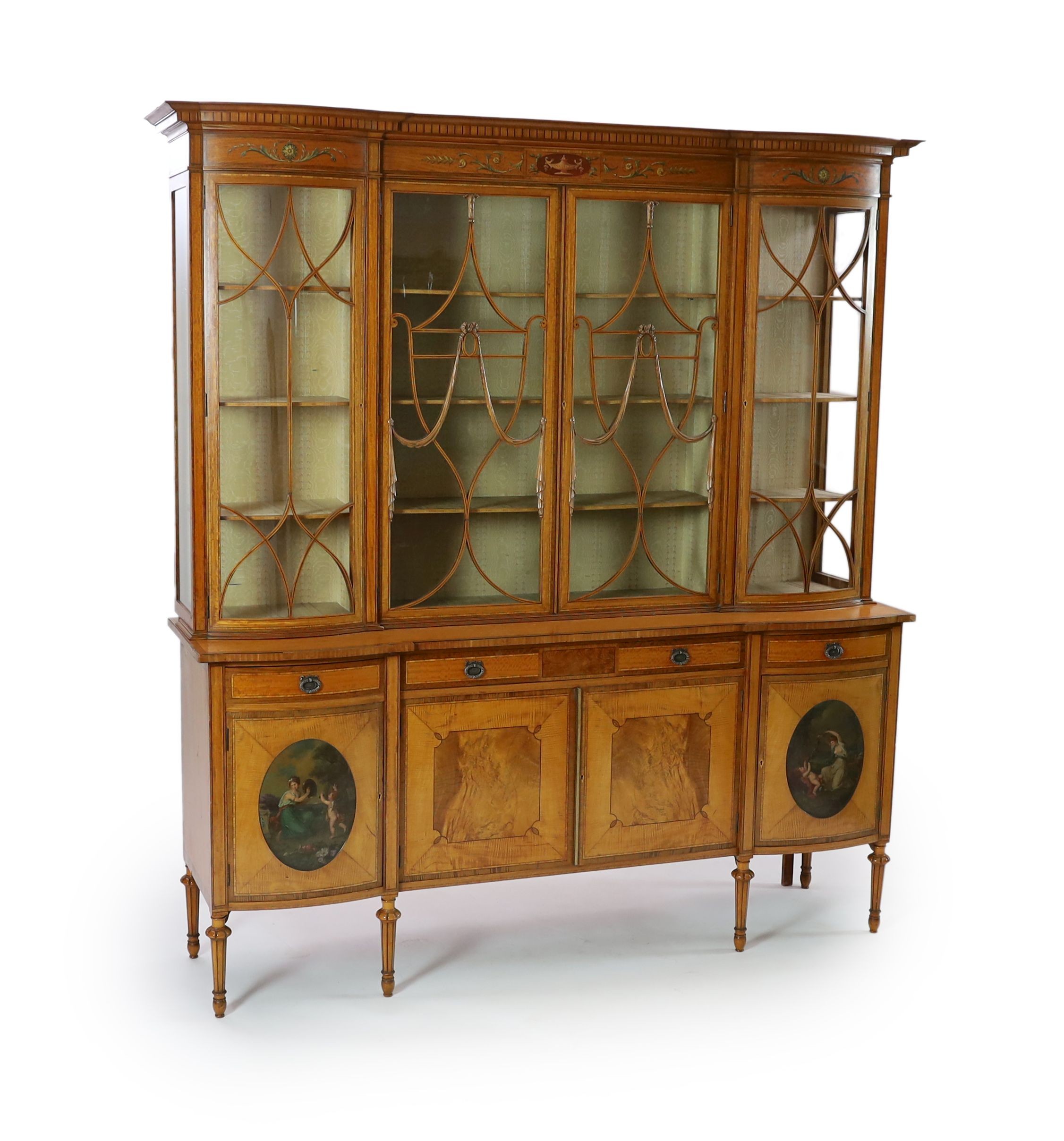 An Edwardian Sheraton revival ebony strung satinwood display cabinet, W.190cm D.47cm H.205cm